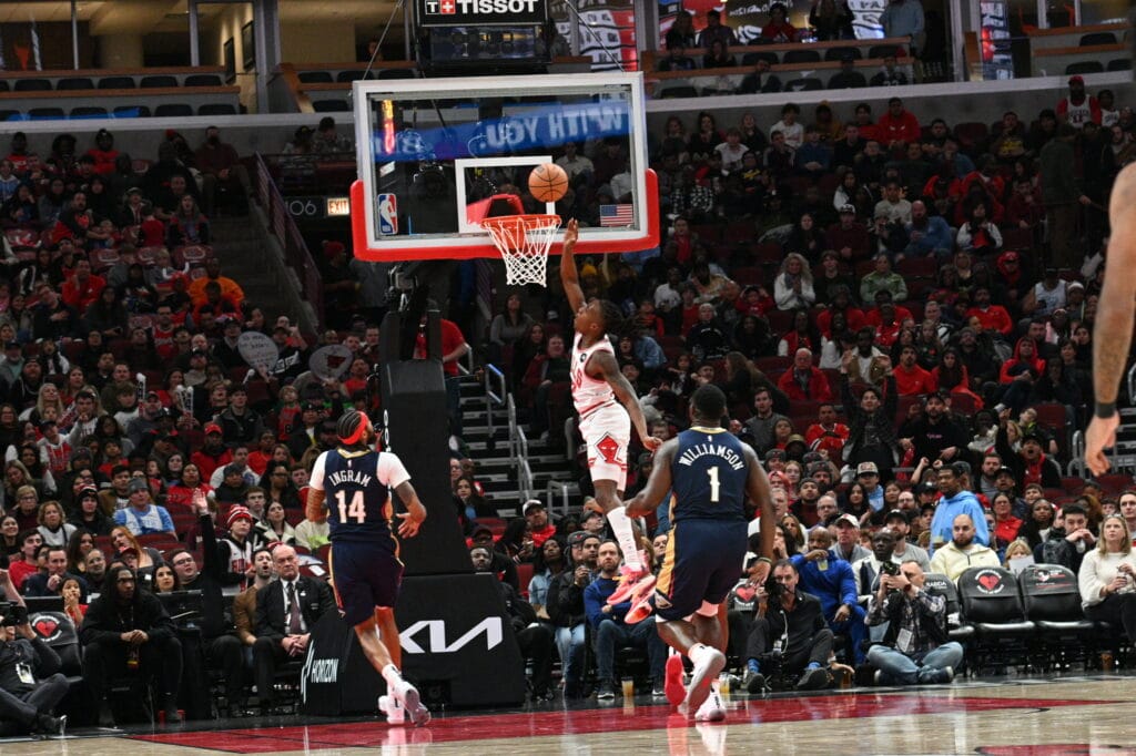 CHICAGO BULLS VS NEW ORLEANS PELICANS AT THE UNITED CENTER IN CHICAGO DECEMBER 2 2023 BULLS 12 AYO DOSUNMU TAKES ALAY UP AND SCORES DURING TH